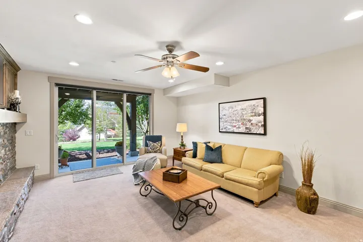 Recessed lighting, ceiling fan, and sliding glass doors to the exterior patio