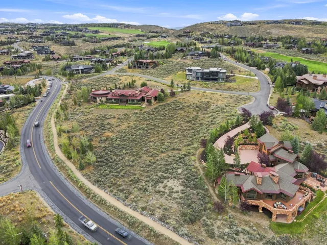 Spacious hillside property featuring multi-level landscaping and surrounding natural terrain
