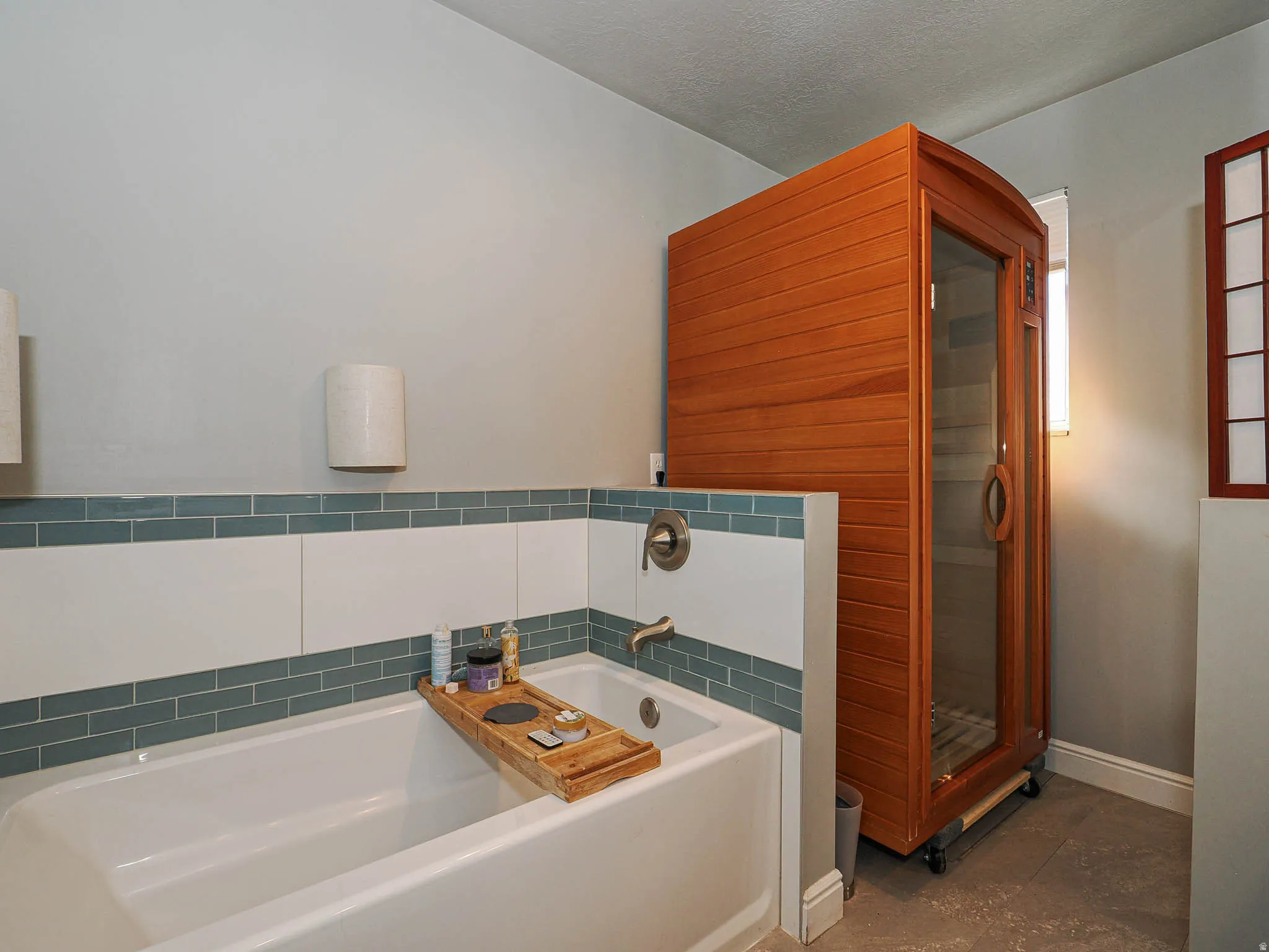 Primary bathroom with sauna and garden tub.