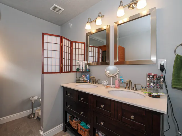 Primary bathroom with double sinks.