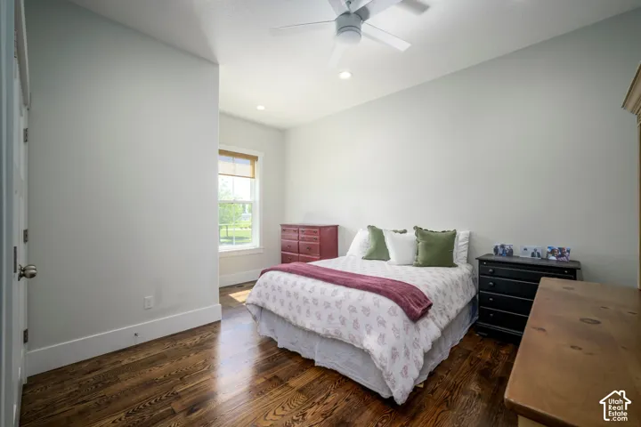 Hardwood-finish flooring, recessed lighting, ceiling fan, and window with natural light