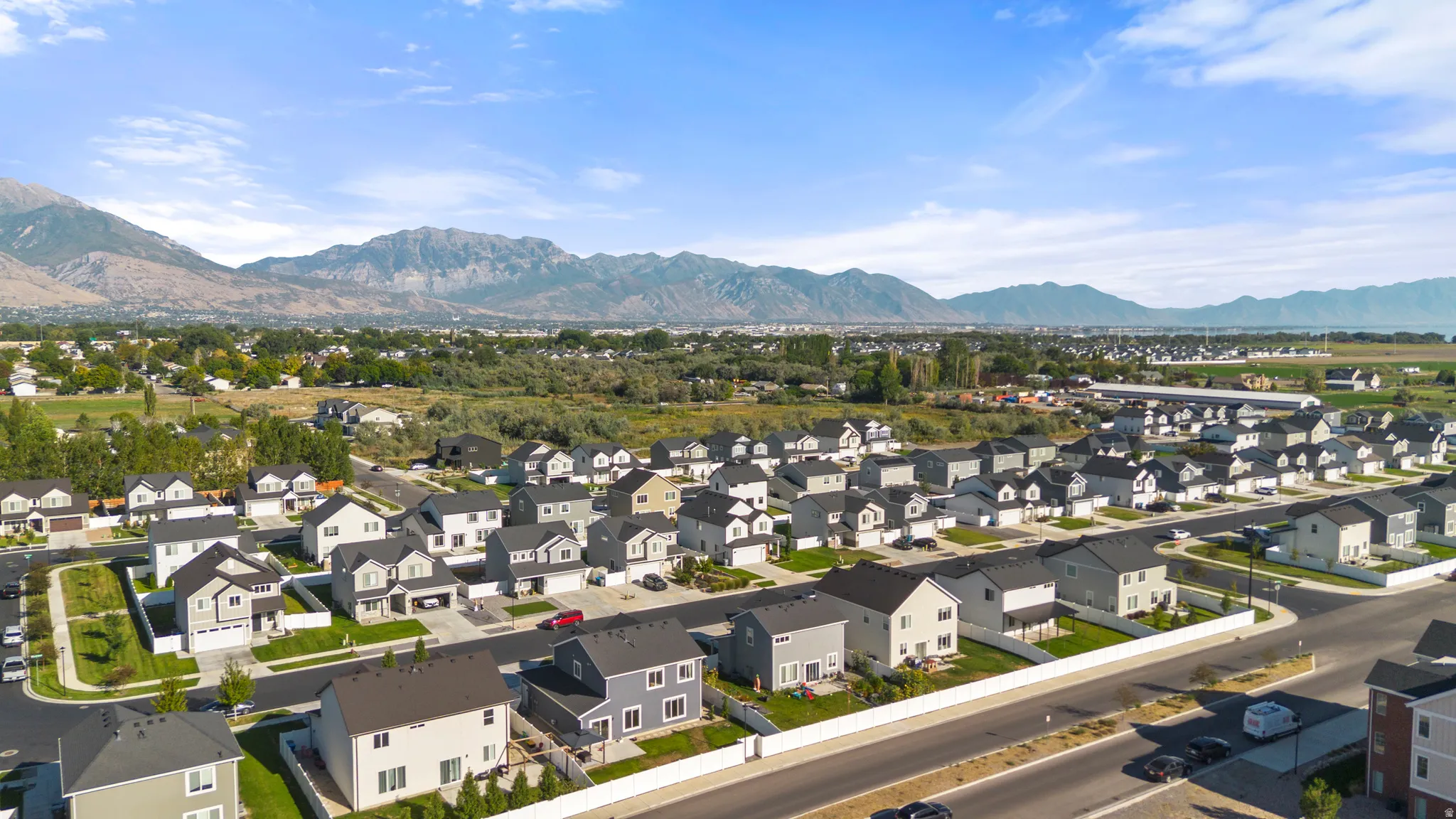 New construction residential development featuring a range of single-family homes with mountain scenery
