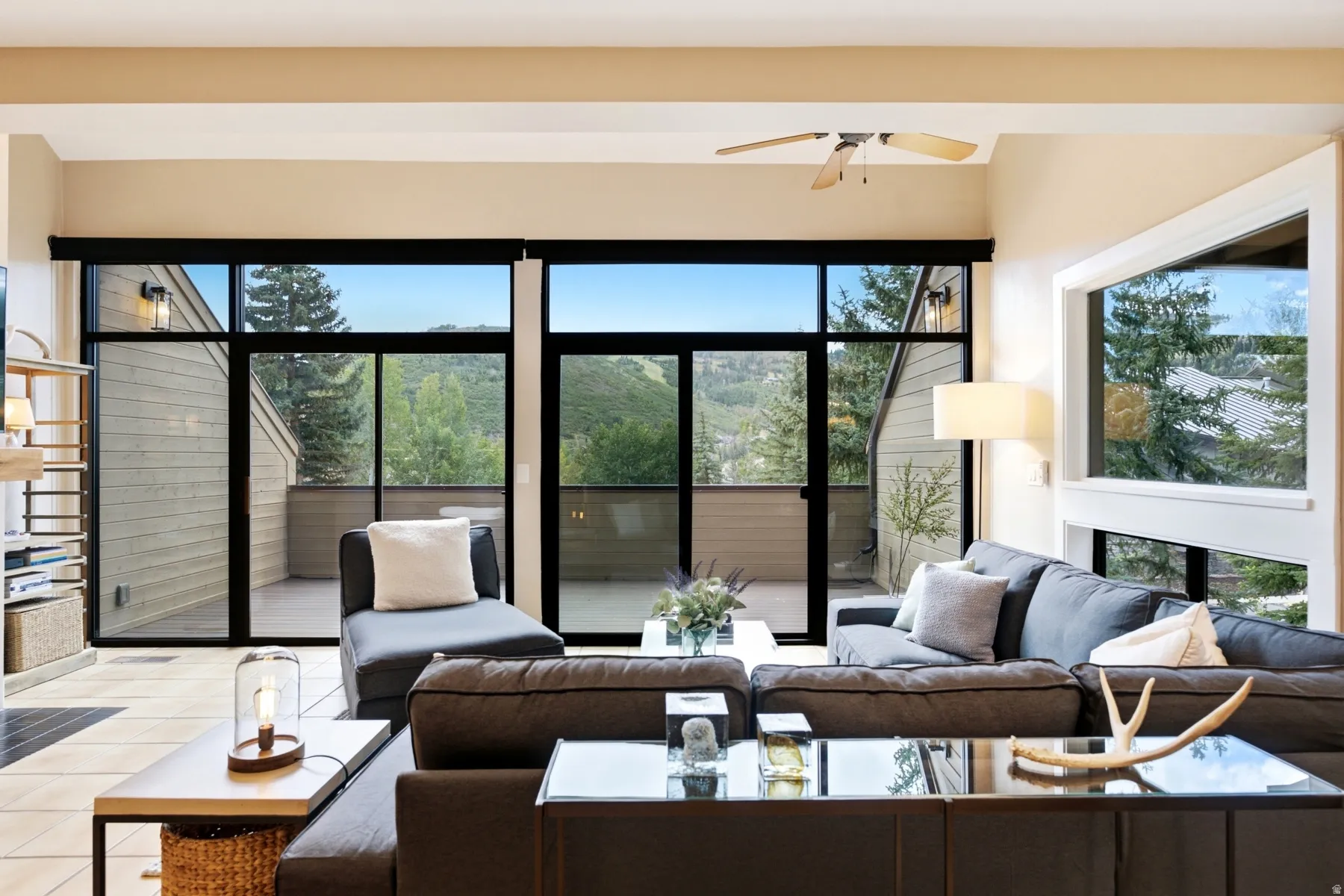Expansive sliding glass doors lead to oversized deck with gorgeous Deer Valley  views