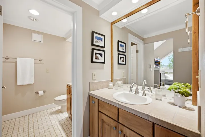 Primary Bath with dual sinks and separate toilet/shower room