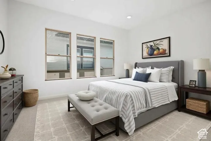 Neutral-toned interior space featuring expansive wall-to-wall carpeting and triple-panel windows with light-finish frames