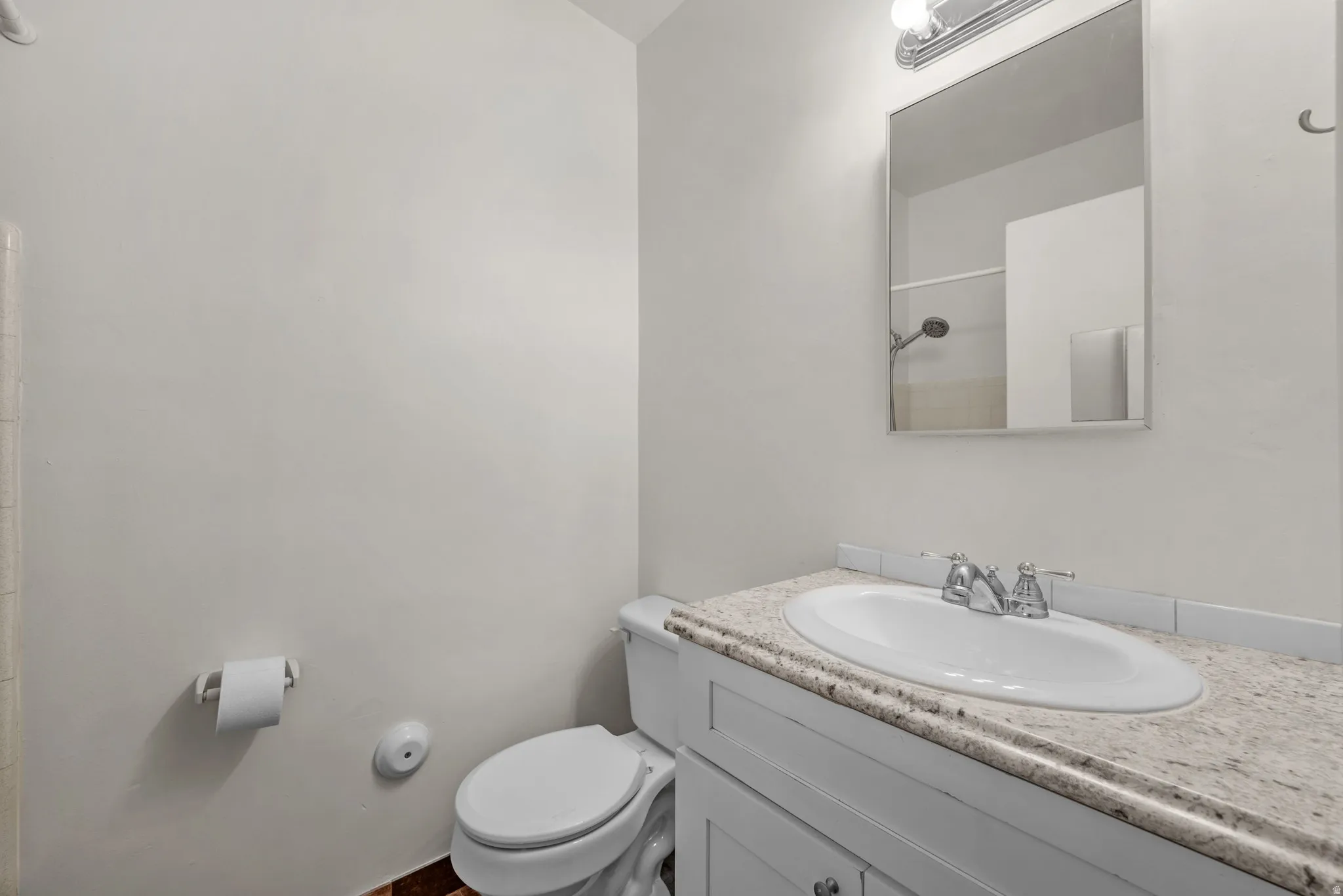 Full Bath with white vanity and tub/shower combination