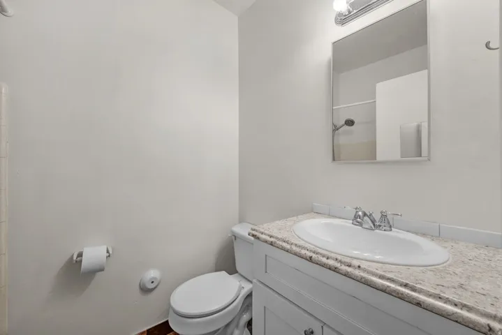Full Bath with white vanity and tub/shower combination