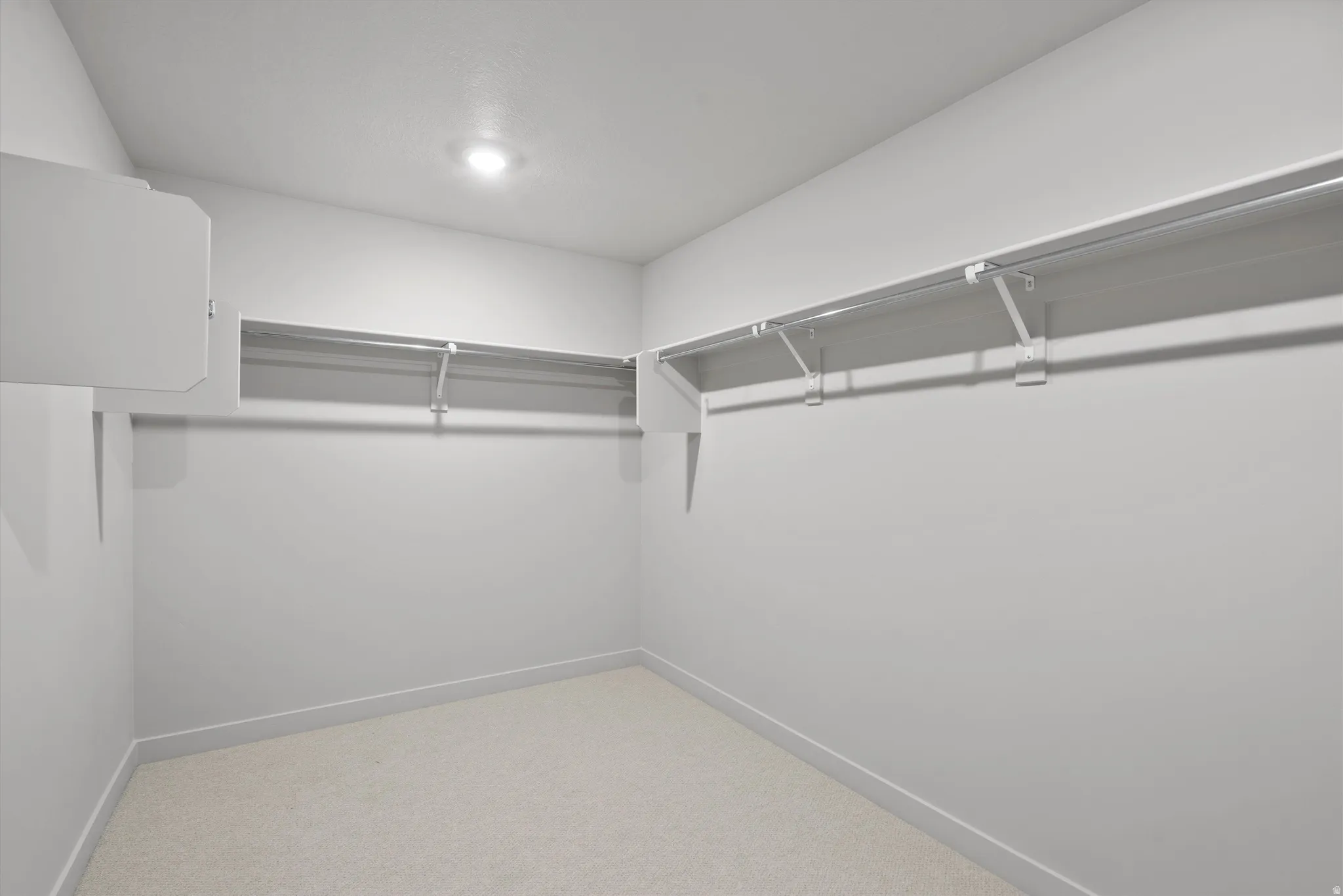 **DISCLIAMER** Some upgrades not photographed. Recessed lighting, wall-mounted shelving, wall-mounted hanging rods, and carpet flooring