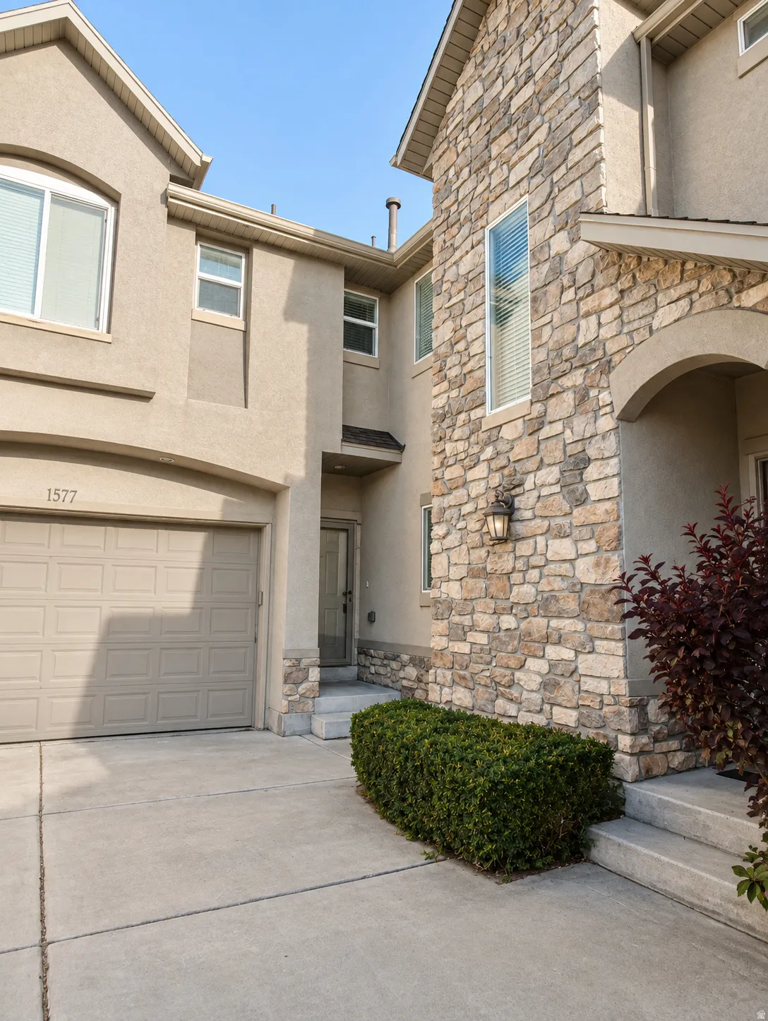 Stone veneer facade with archway entry