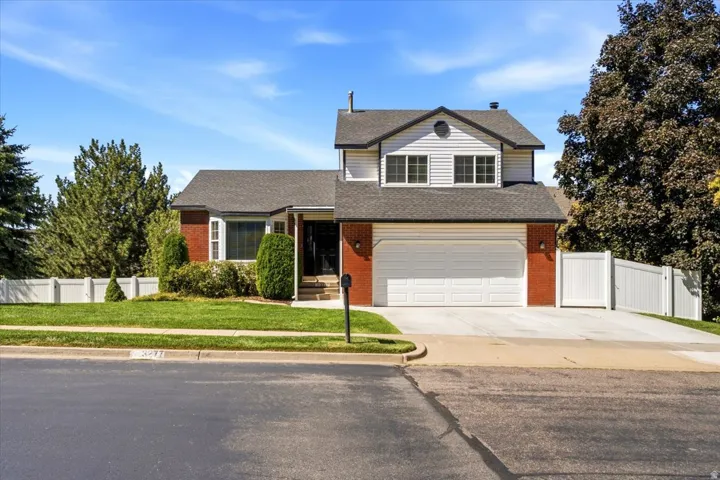 Brick and siding exterior with a two-car garage