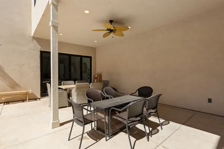 Covered patio with a ceiling fan, recessed lighting, and a stucco finish