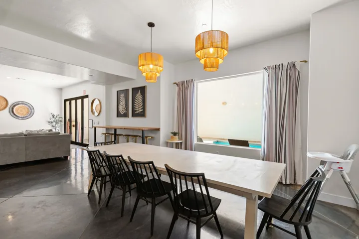 Open-concept room featuring polished concrete flooring and white walls