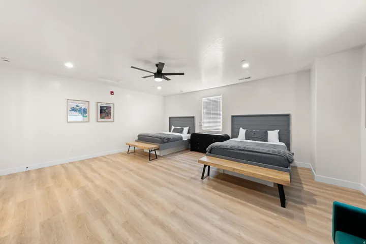 Wood-finish flooring, recessed lighting, and a ceiling fan