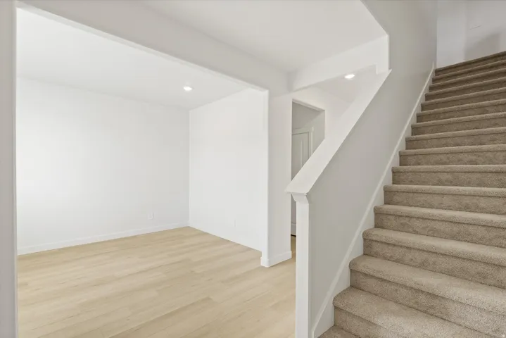 **DISCLAIMER** Interior package may vary. Light wood-finish flooring, recessed lighting, and a neutral color palette