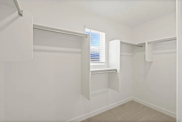 **DISCLAIMER** Interior package may vary. Built-in closet shelving and hanging rods, window with blinds, and carpeted flooring