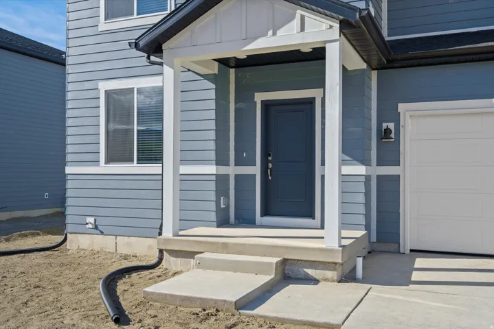 Blue siding exterior with white trim details