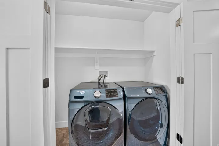 Dedicated laundry area with a built-in shelf