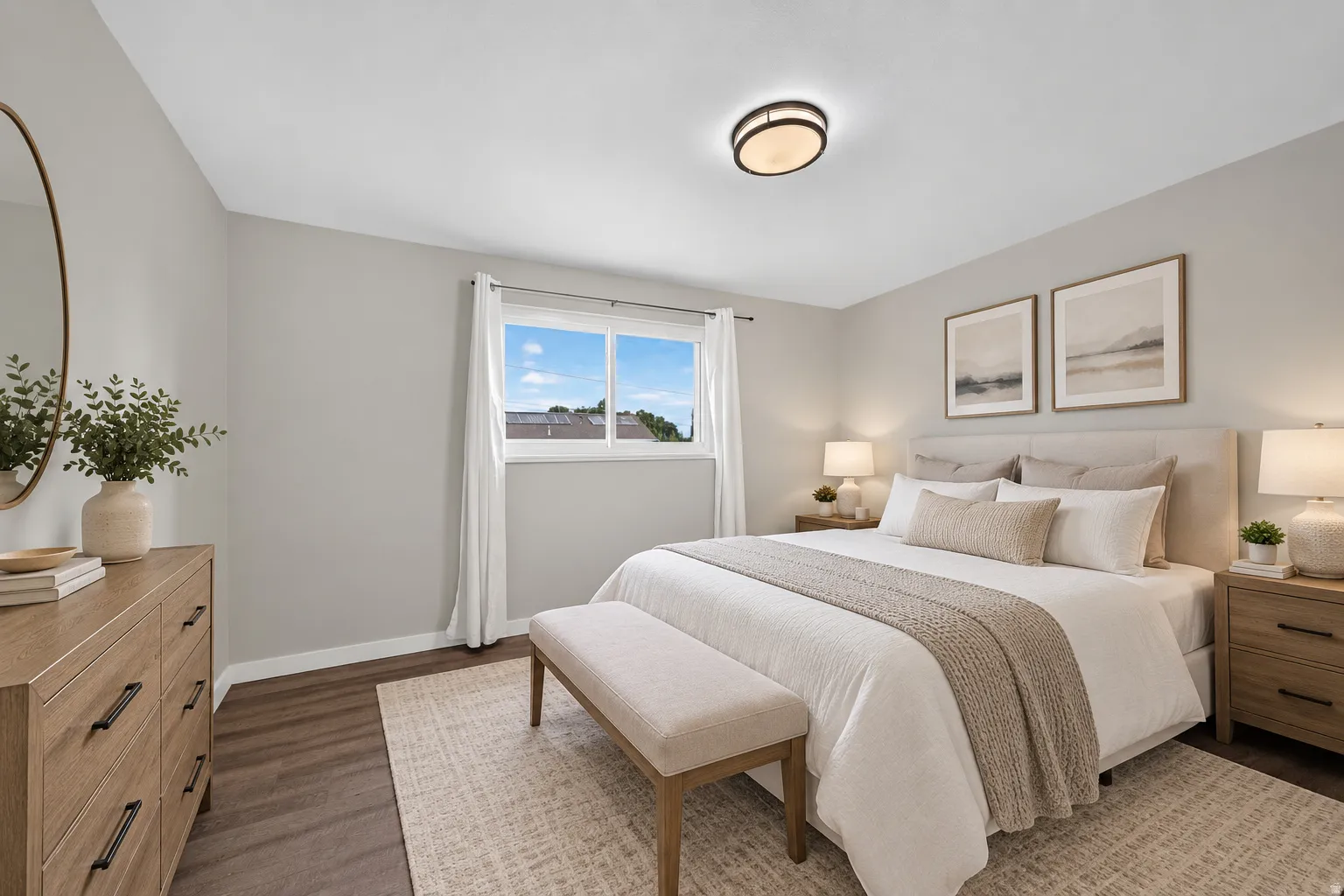 Virtually Staged Image. Neutral wall colors, wood-finish flooring, a flush-mount ceiling light fixture, and a window with white trim