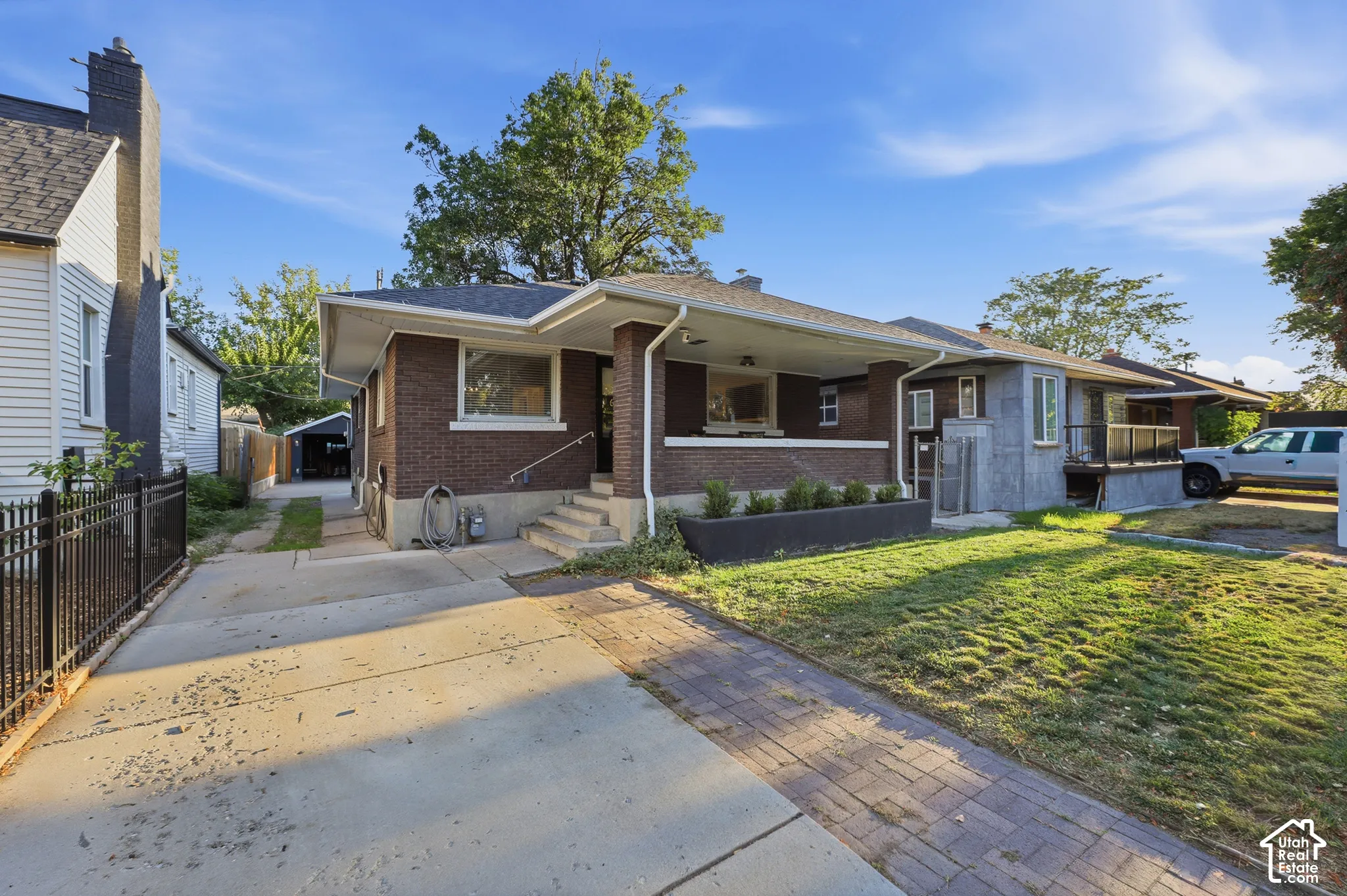 Brick exterior with a covered porch