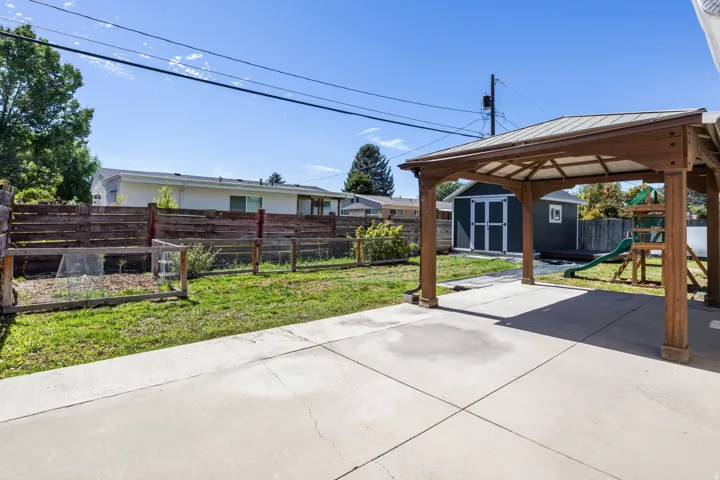 Expansive concrete patio with a covered gazebo