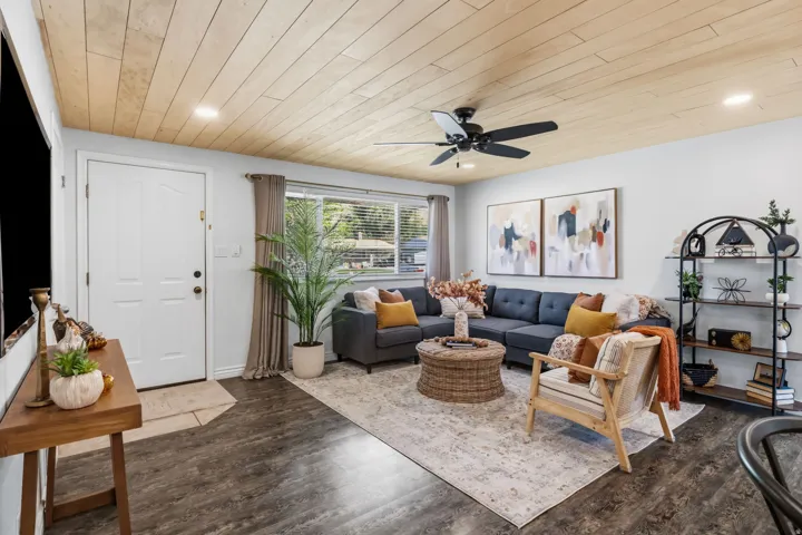 Wood-finish flooring throughout, complemented by a wood-paneled ceiling