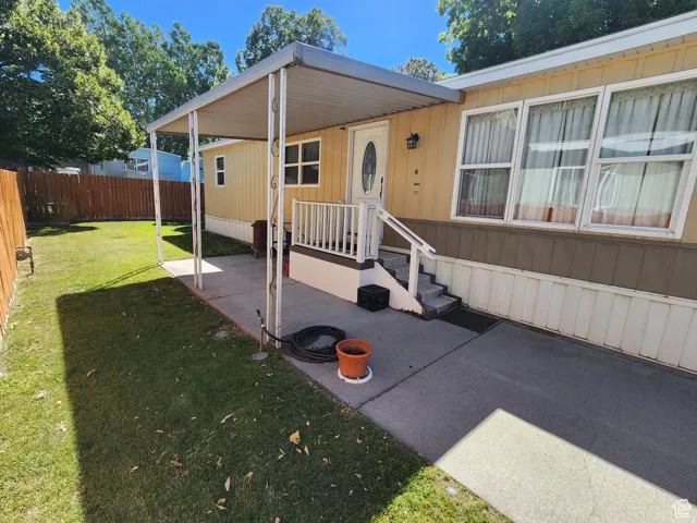 Covered concrete patio with direct home access