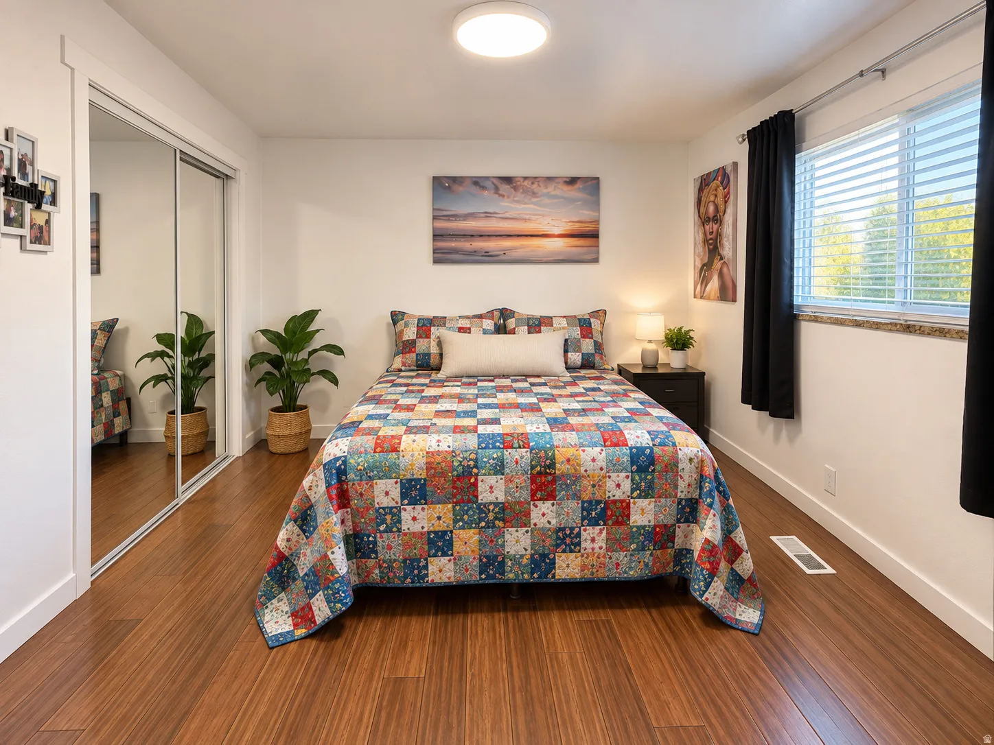 Bedroom 2, Wood-finish flooring, mirrored closet doors, and a window with blinds and a stone sill
