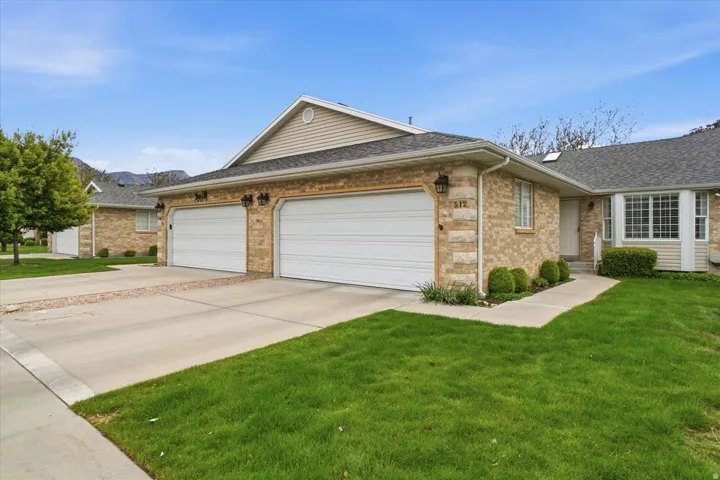 Brick and siding exterior with a two-car garage