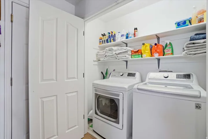 Dedicated laundry area with a white paneled door