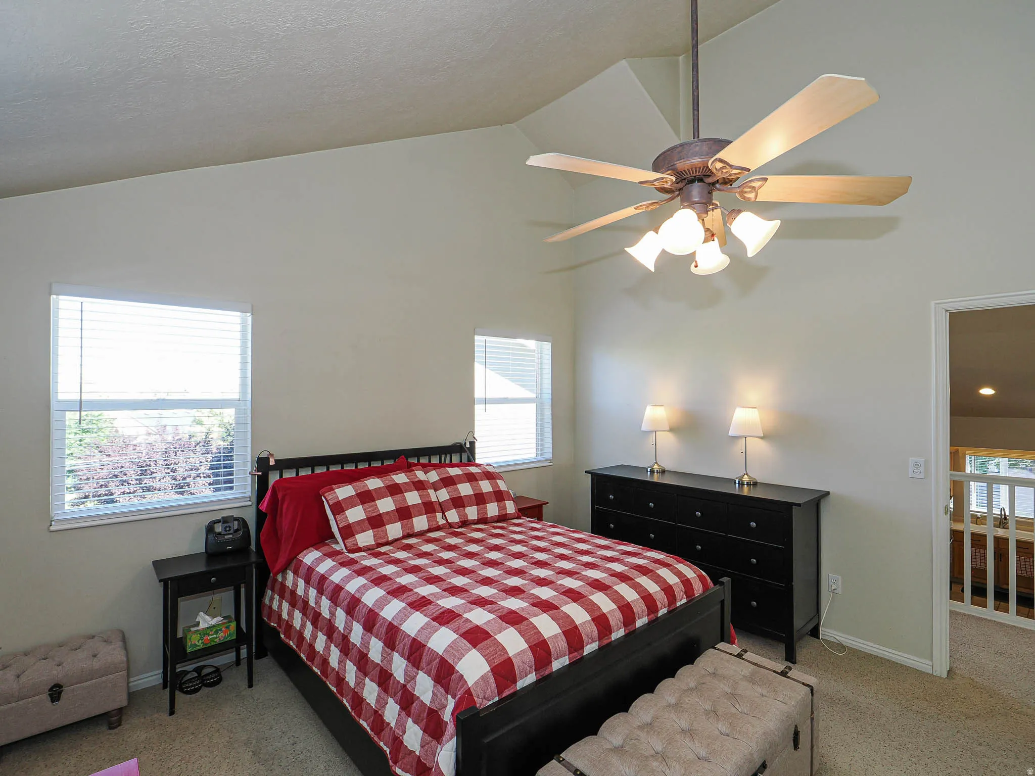 Primary with vaulted ceilings.