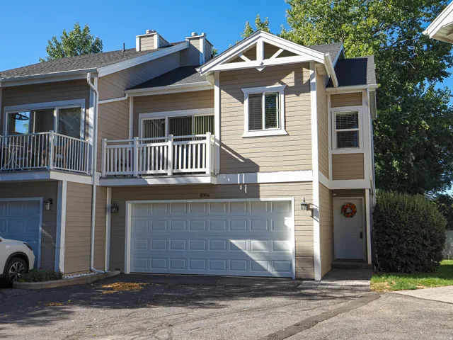 East facing with private balcony and 2 car garage. 2 parking spaces in front of garage.
