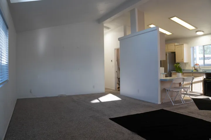 Vaulted ceiling with overhead lighting