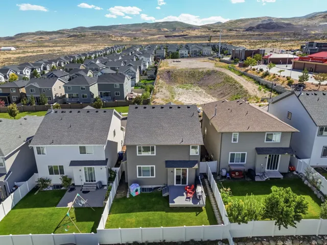 Expansive neighborhood with numerous properties, each featuring a private backyard