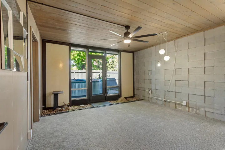 Wood-panel ceiling with a ceiling fan