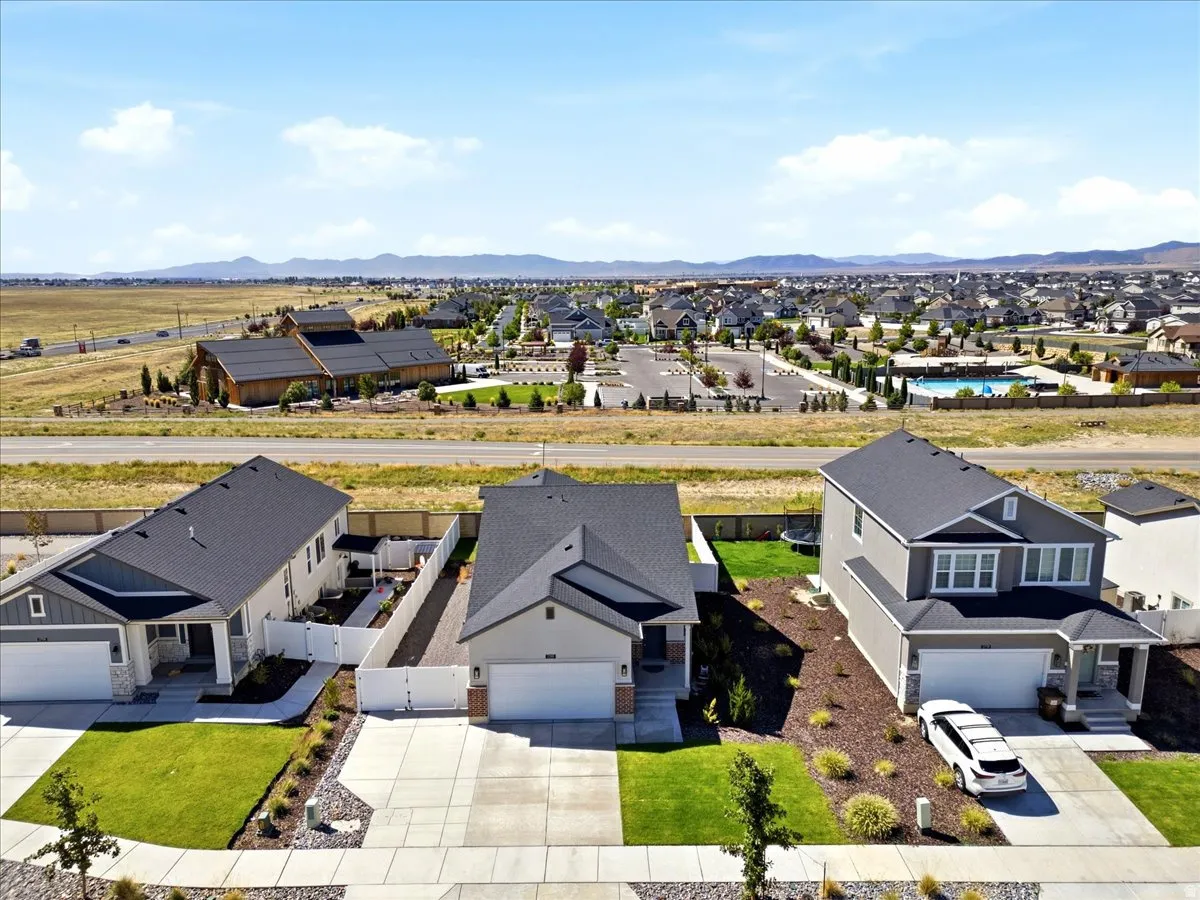 Contemporary residential architecture with attached garages and established landscaping, surrounded by a developed neighborhood