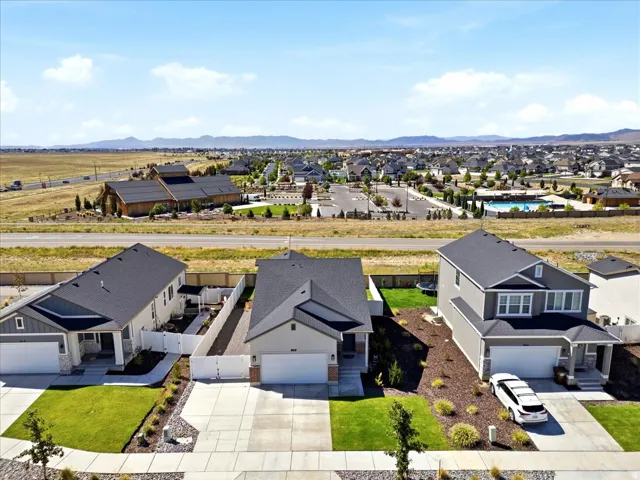 Contemporary residential architecture with attached garages and established landscaping, surrounded by a developed neighborhood