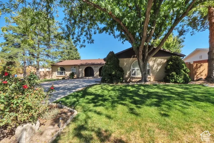 Brick exterior with arched window and doorway accents