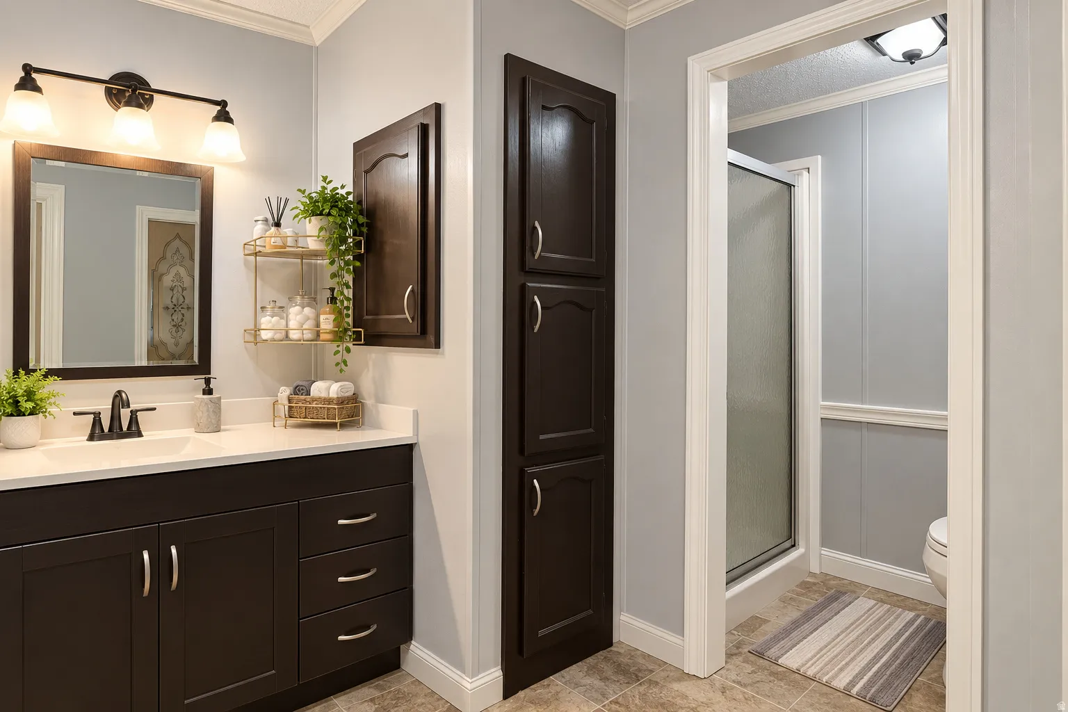 Bathroom featuring a vanity with dark wood-finish cabinetry, a white countertop, and a rectangular undermount sink