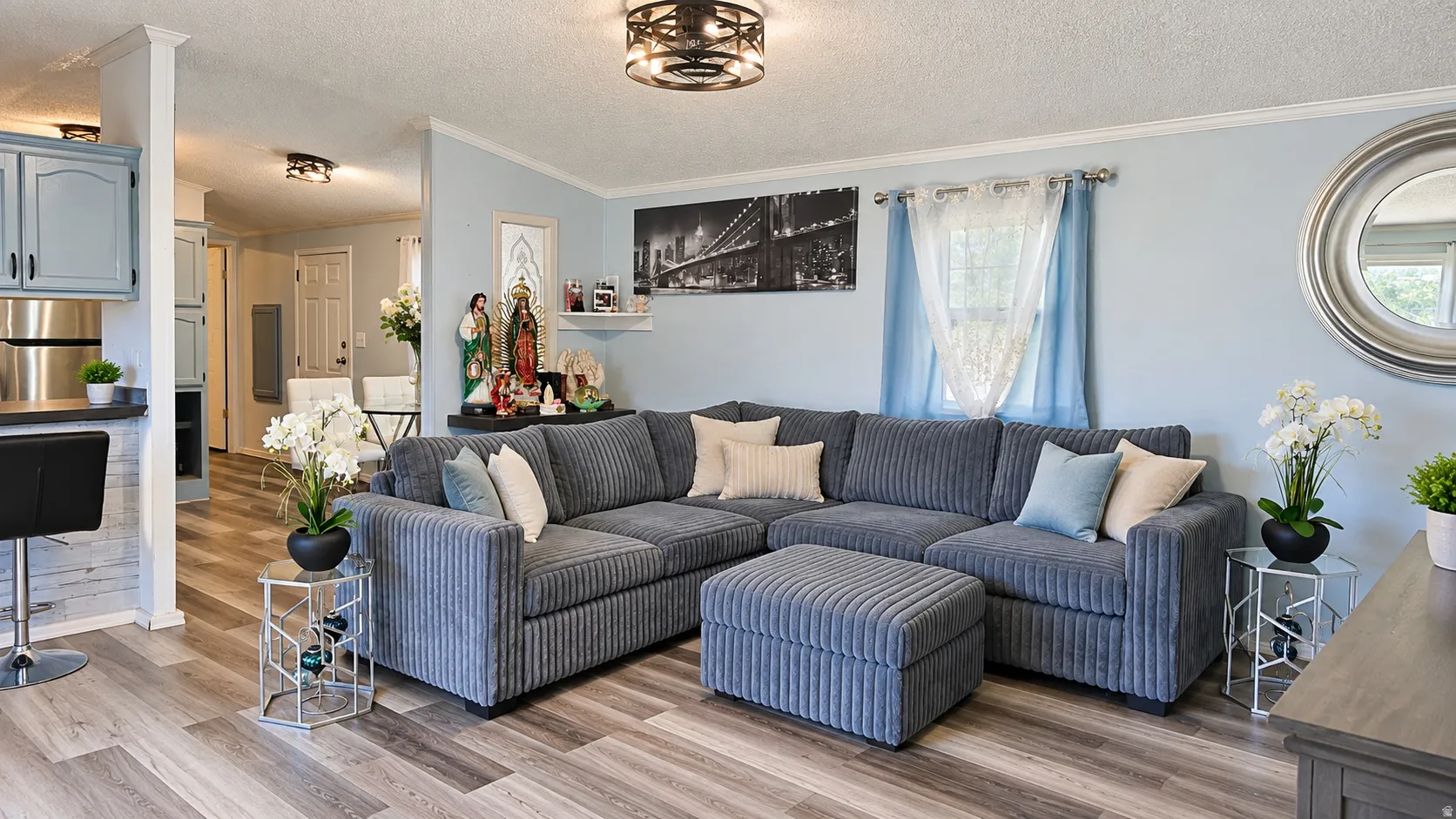 Wood-finish flooring, recessed lighting, and a contemporary ceiling fixture