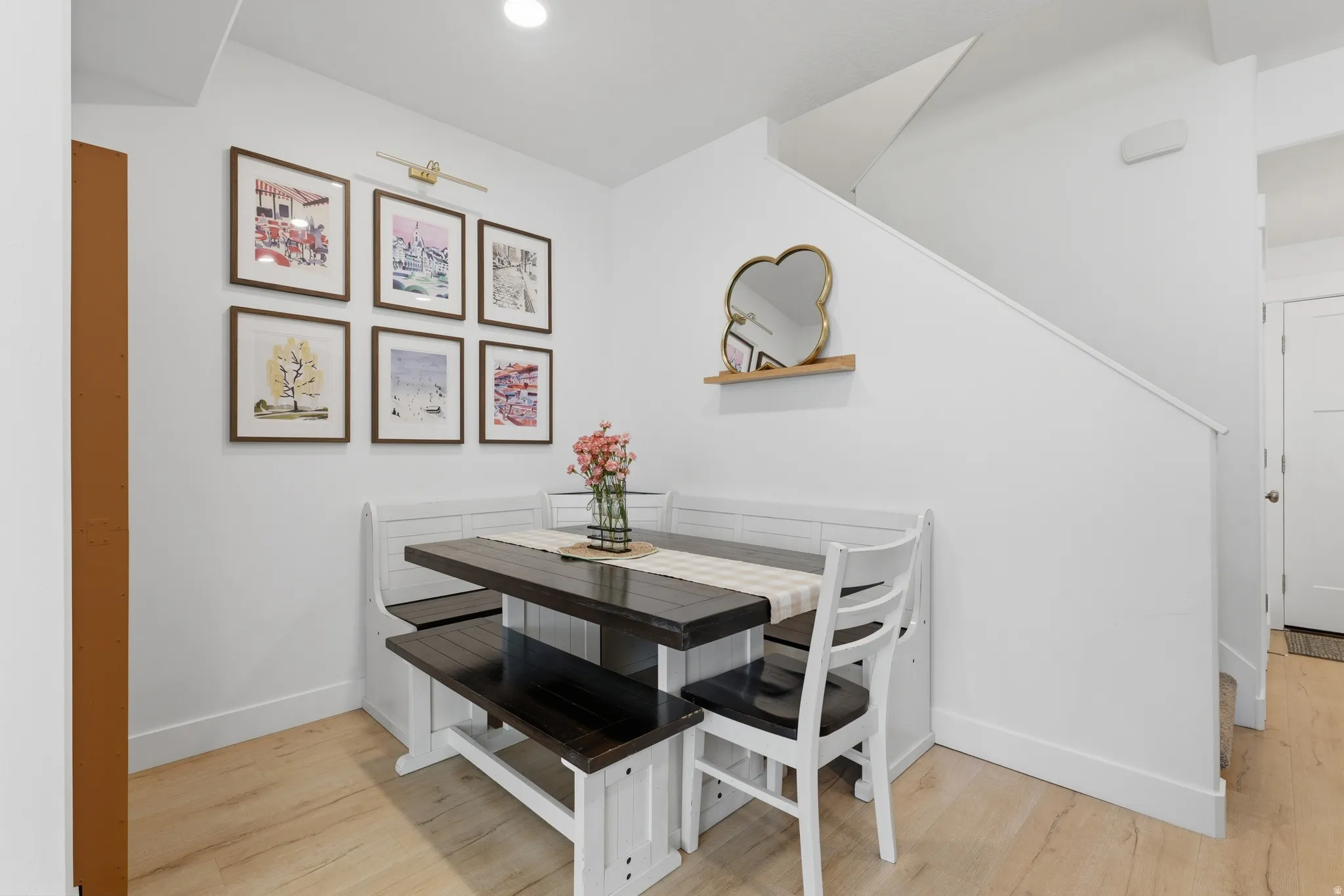 Built-in dining nook with wood-finish flooring