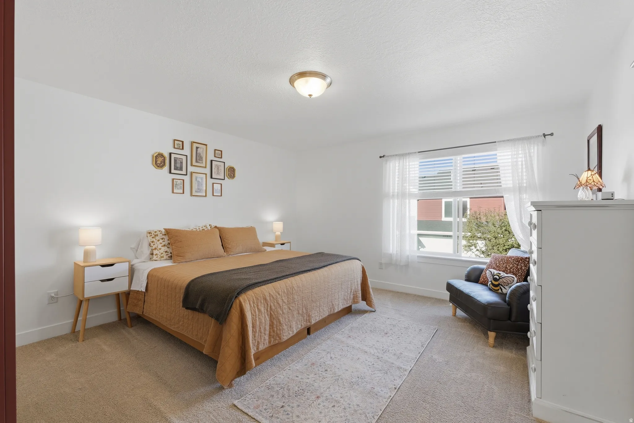 Recessed lighting in a spacious room with light-colored carpeting