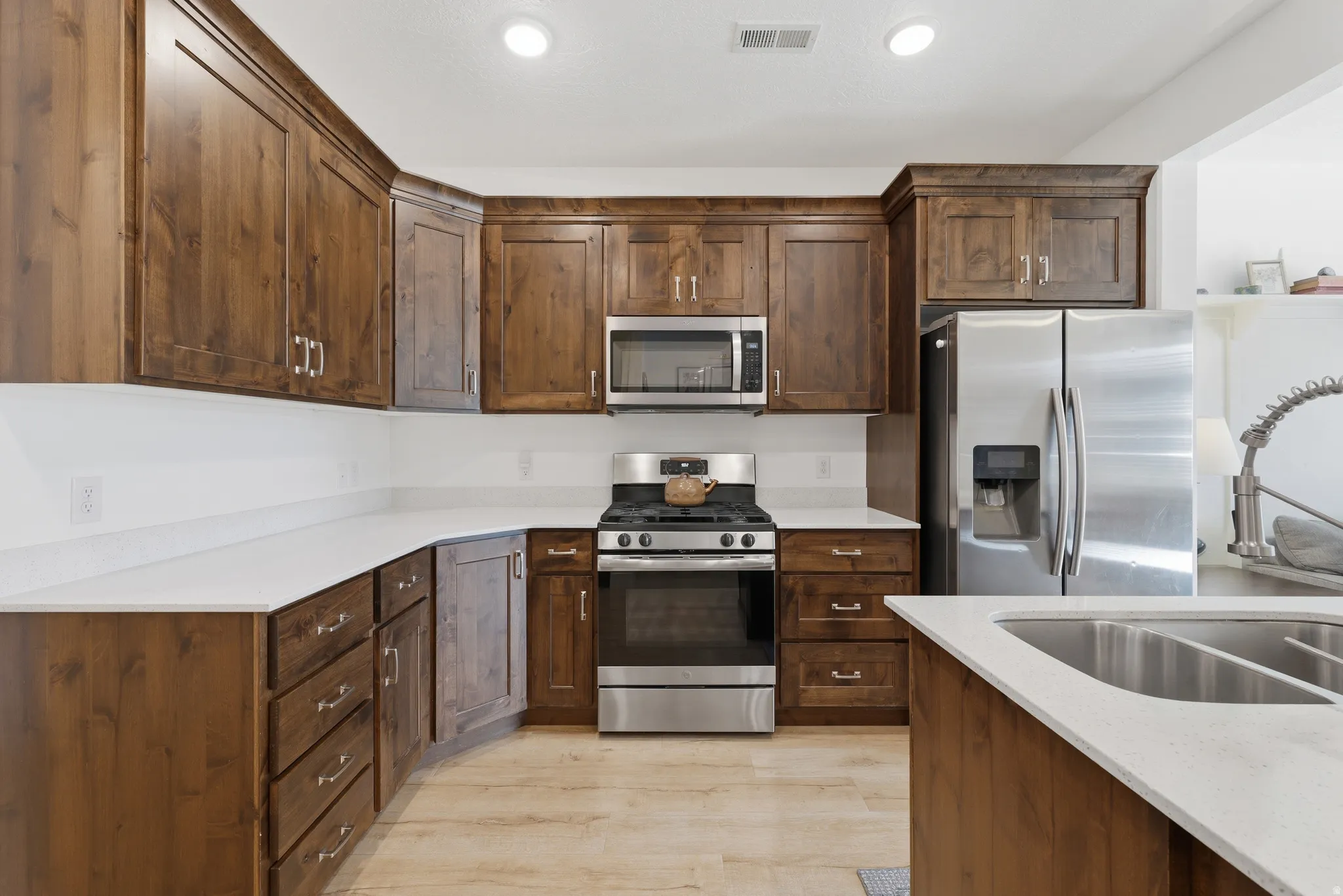 Wood-finish cabinetry with silver-tone hardware