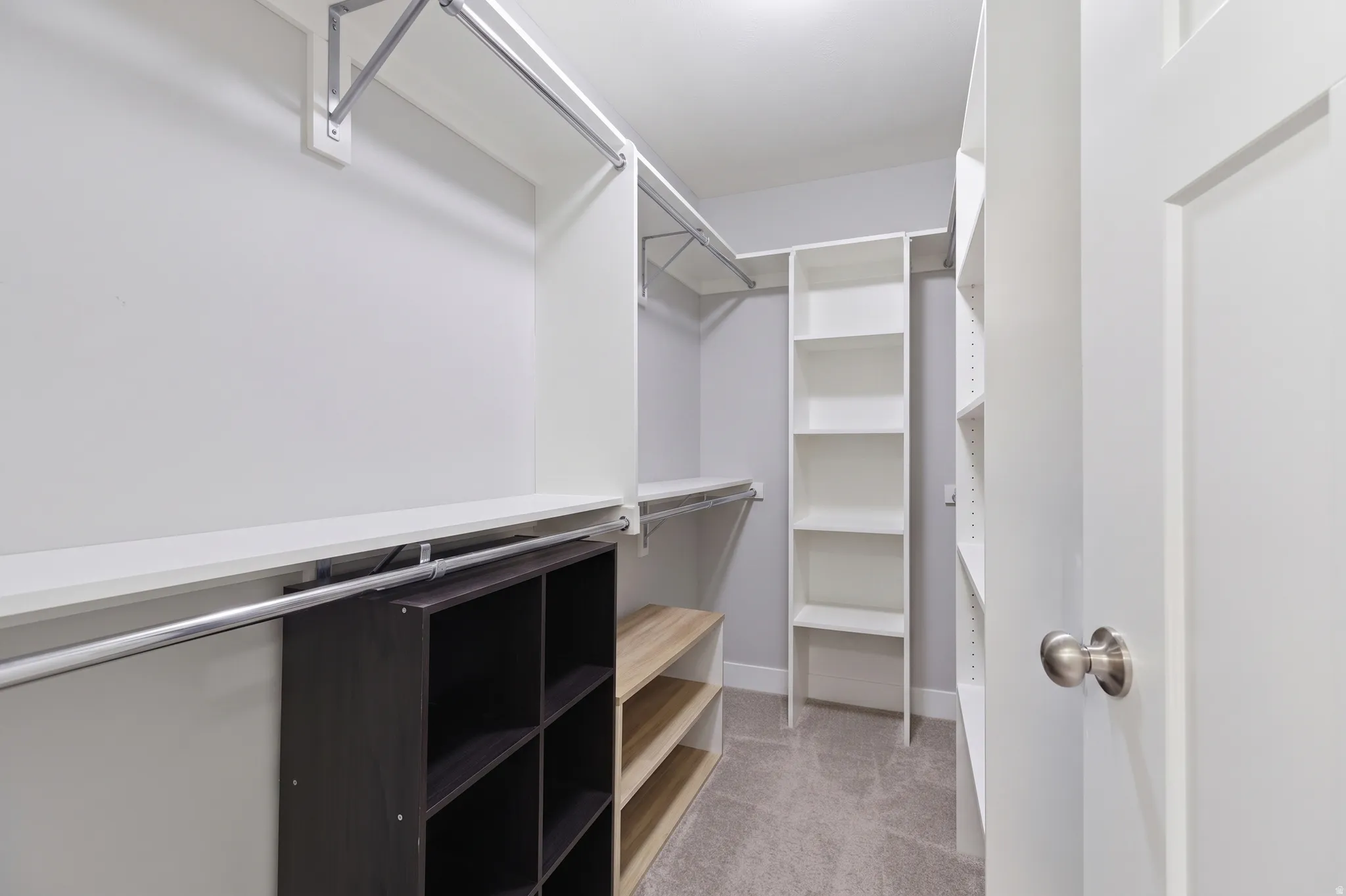 Built-in shelving, hanging rods, and storage cubbies