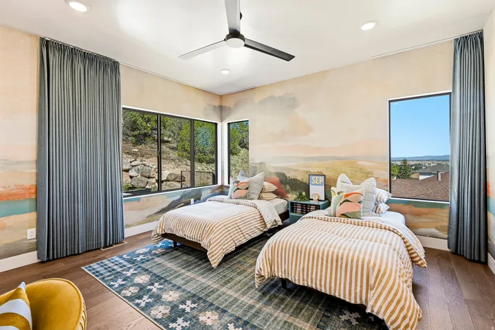 Recessed ceiling lighting, wood-finish flooring, and a ceiling fan with integrated lighting