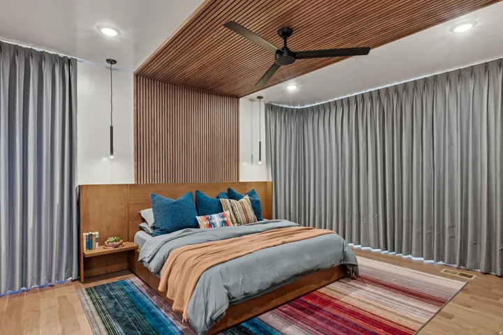 Wood-finish flooring with a wood-slat accent wall