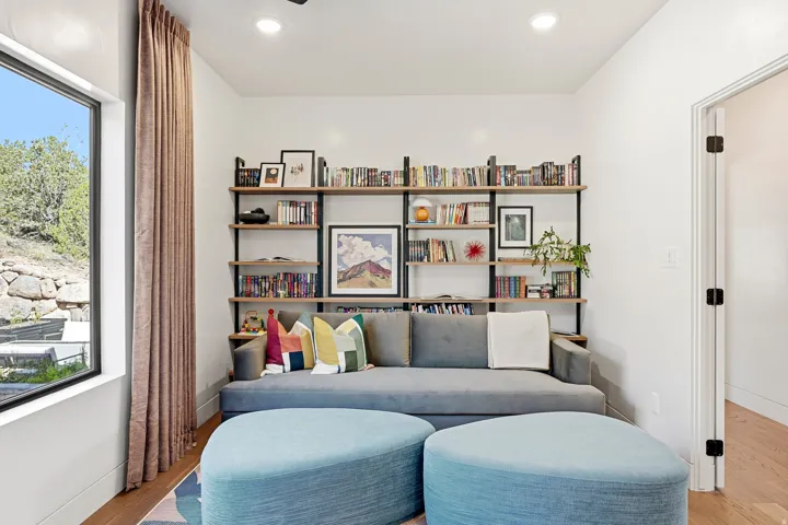 Built-in shelving unit with wood-finish shelves and matte black framing