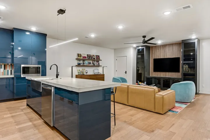 Open-concept living space with wood-finish flooring