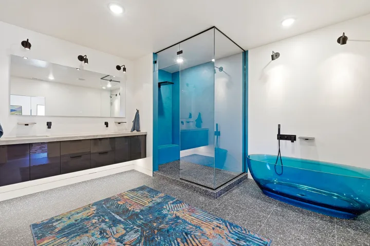 Dual vanity with dark cabinetry and an integrated countertop