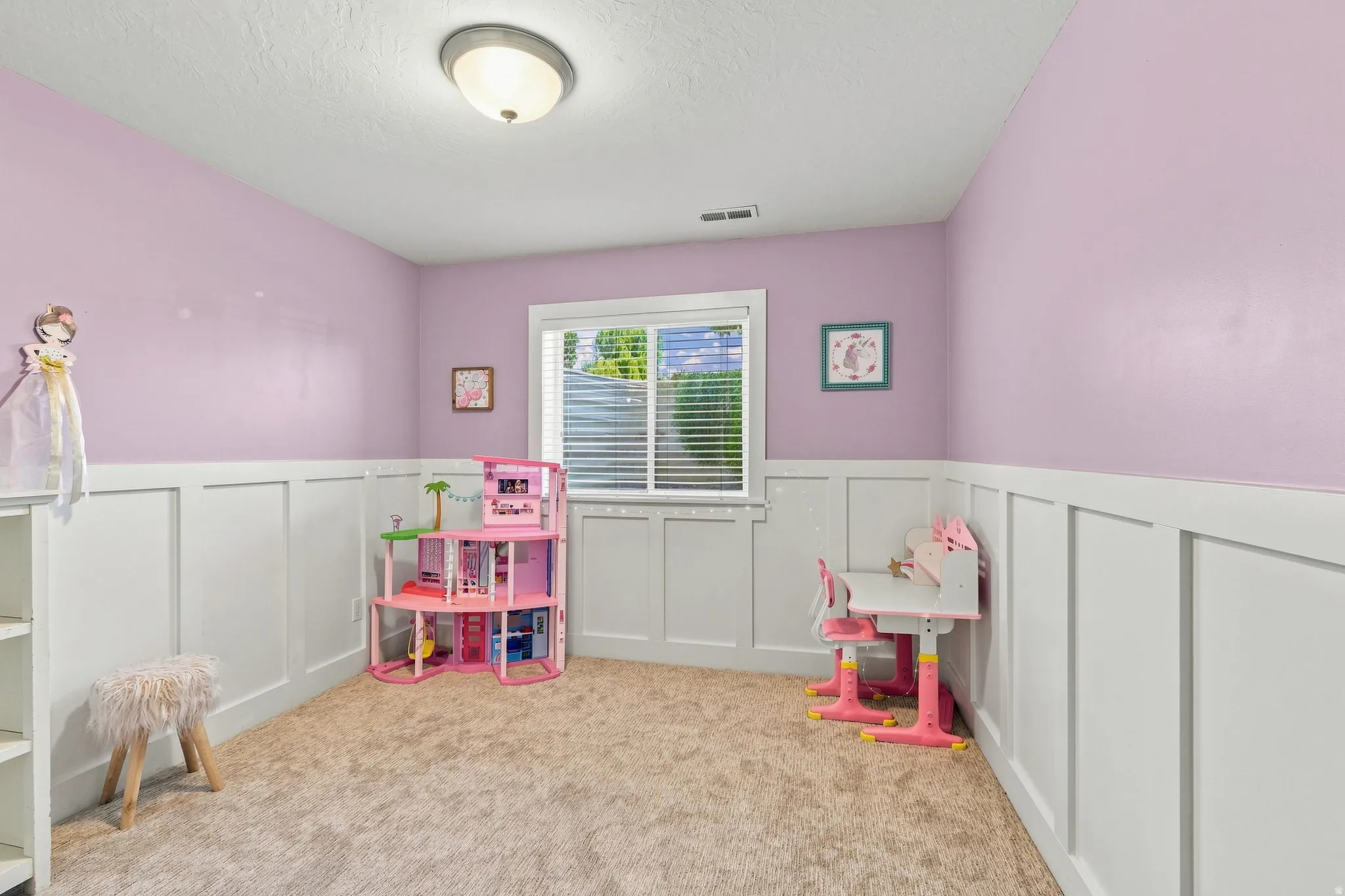 Wall paneling with a window featuring horizontal blinds