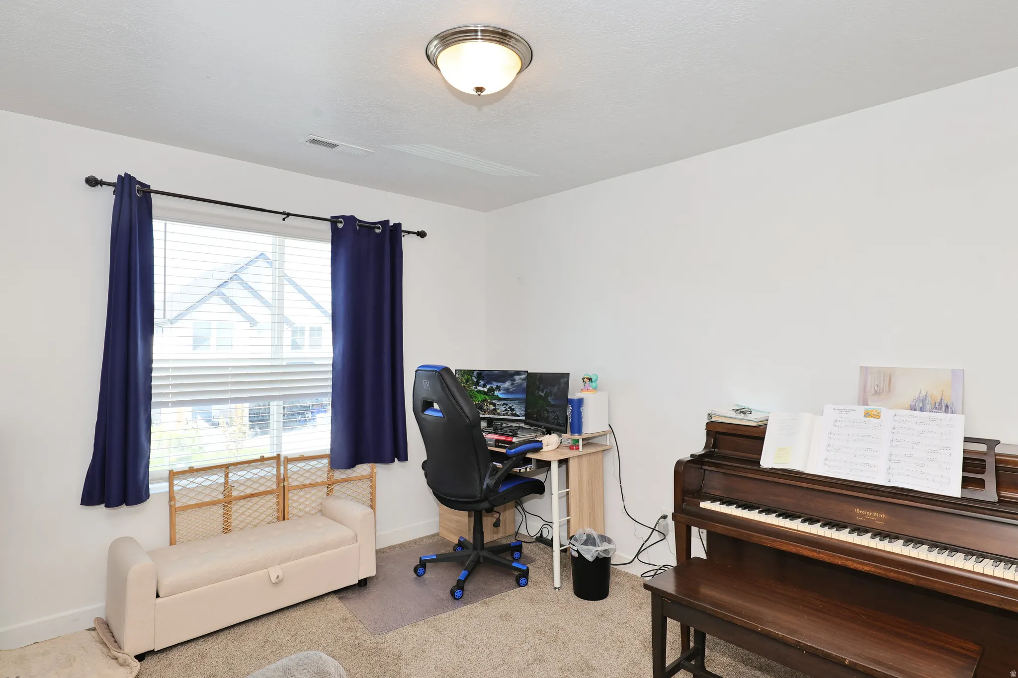 Recessed lighting, window with blinds, carpeted flooring, and white walls